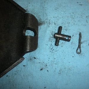 Speed change plate, T-bolt?, and cotter key that holds the adjustment chain to the plate.