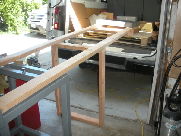 I placed a single support under the center. I made sure that the 2x4s were directly supporting the load.